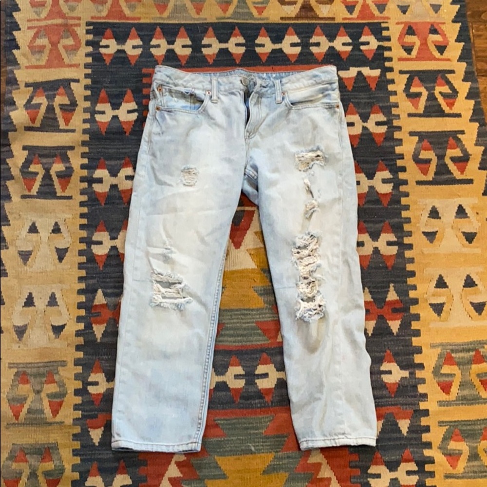 Ripped light denim boyfriend style